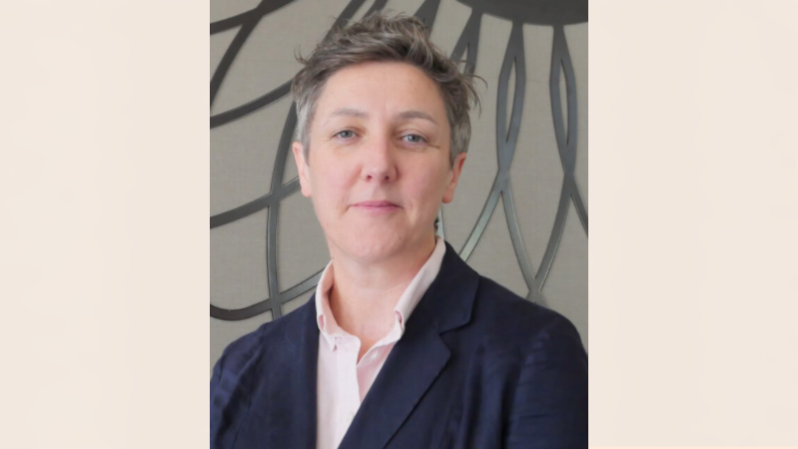 Academic with a muted smile